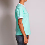 Side profile shot of the Wild Mint T-shirt by Holystoked India, worn by a female skater from Bangalore. 