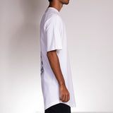 Side profile picture of the Dandruff White long t-shirt, worn by a skateboarder.