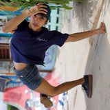 Bgirl wearing Flexi Blue T-shirt by Holystoked at the Cave Skatepark.