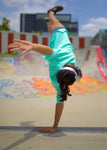 B-girl doing a one-handed freeze wearing the Mint Kong t-shirt by Holystoked Bangalore.