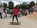 Girl riding skateboard during skateboarding class in Bangalore